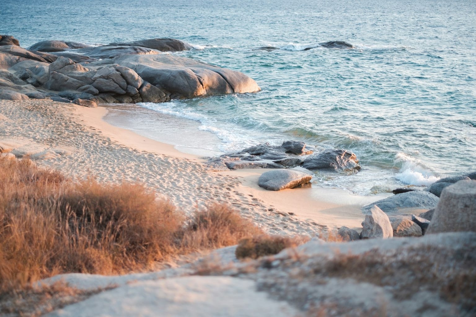 A simple taverna table with sea view on a budget-friendly Greek island