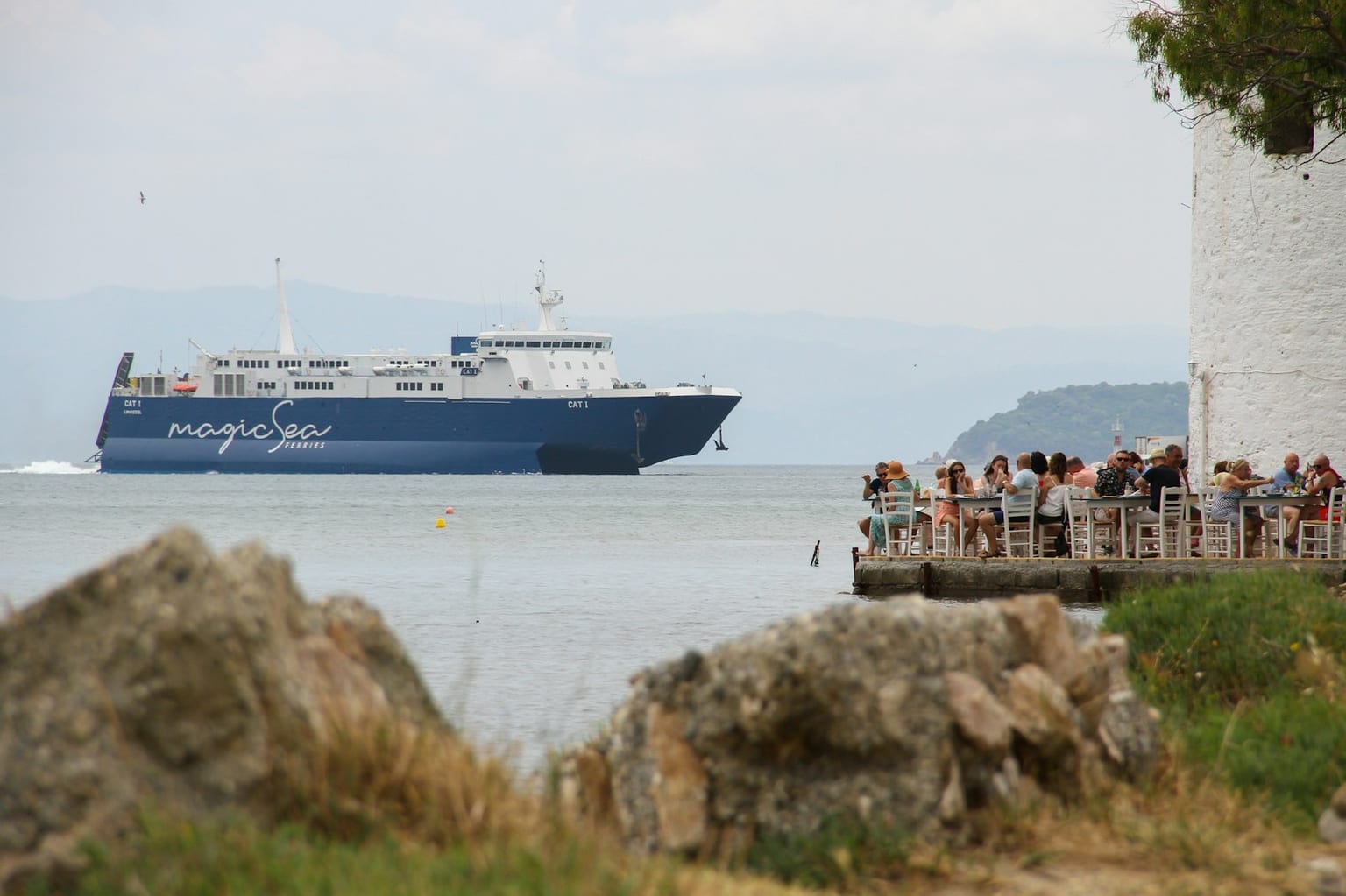 A ferry crossing the Aegean Sea near a Greek island